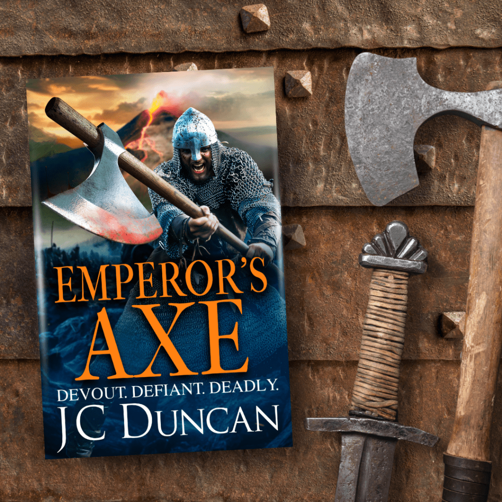 Cover image for Emperor'sAxe by JC Duncan, alongside an axe head anf sword hilt. 