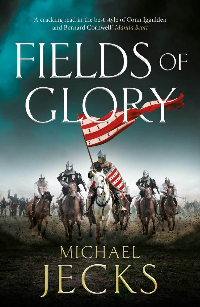 Image shows the book cover for Fieldsof Glory by author Michael Jecks. The image shows 5 mounted medieval warriors, one holding a banner, hurrying towards the viewer with a battlescene image behind them 