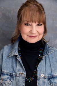 Image of author Fiona J Makintosh wearing a denim jacket andblack polo neck jumper